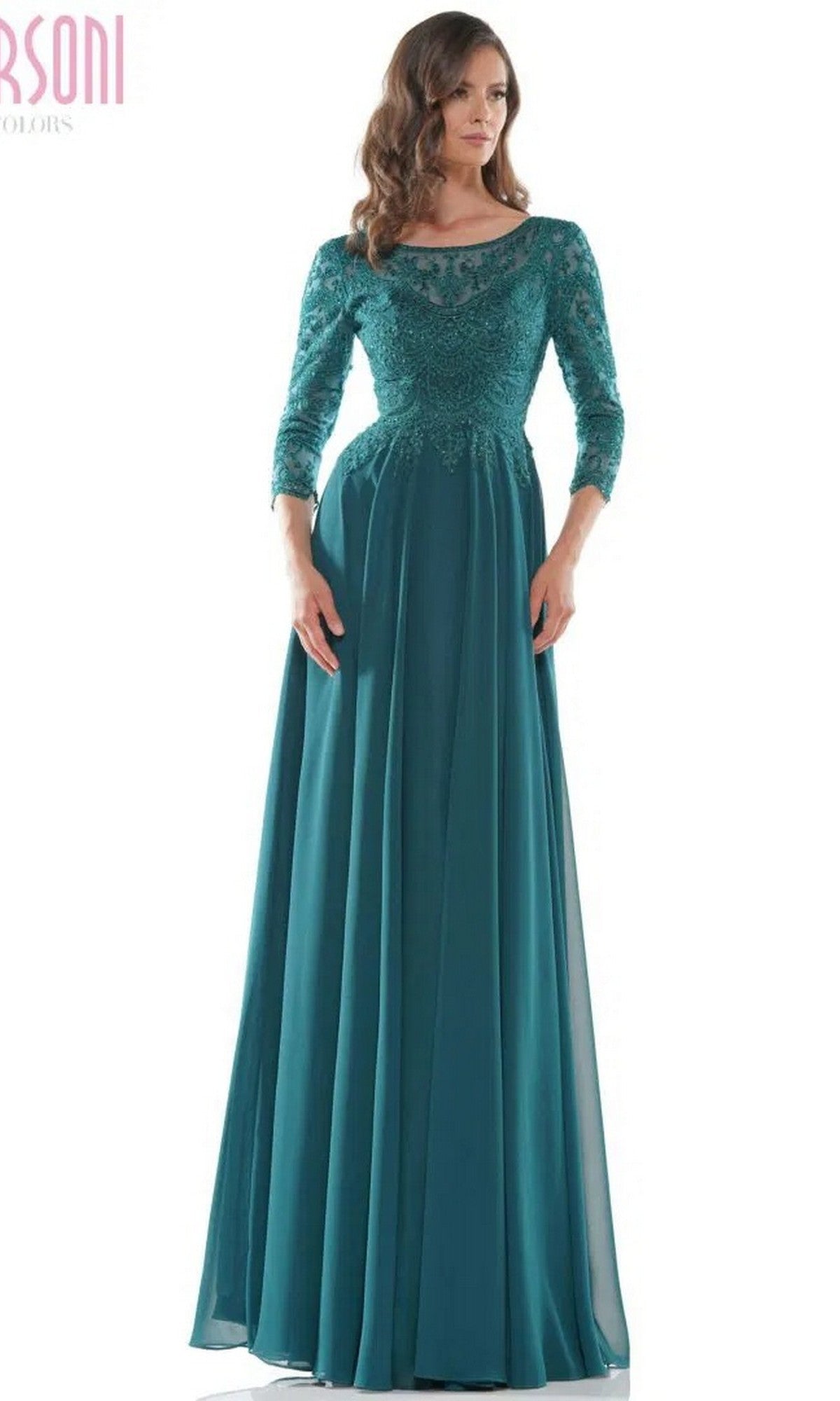 A woman in a long formal dress, the Marsoni M238SL in deep green, featuring a beaded bodice and a flowing chiffon A-line skirt.